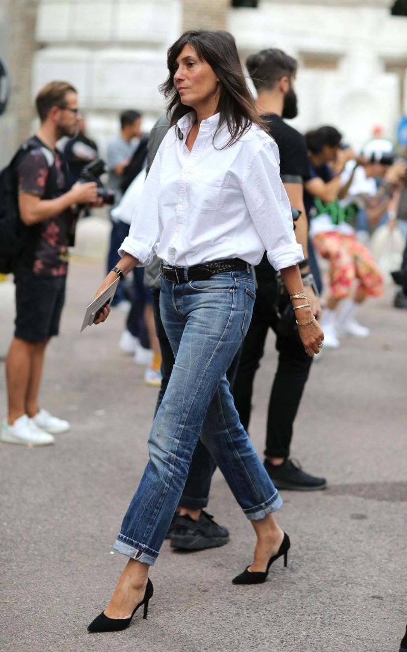 Emanuelle Alt wearing Jeans, White Button Down, Kitten Heels walking at Fashion Week