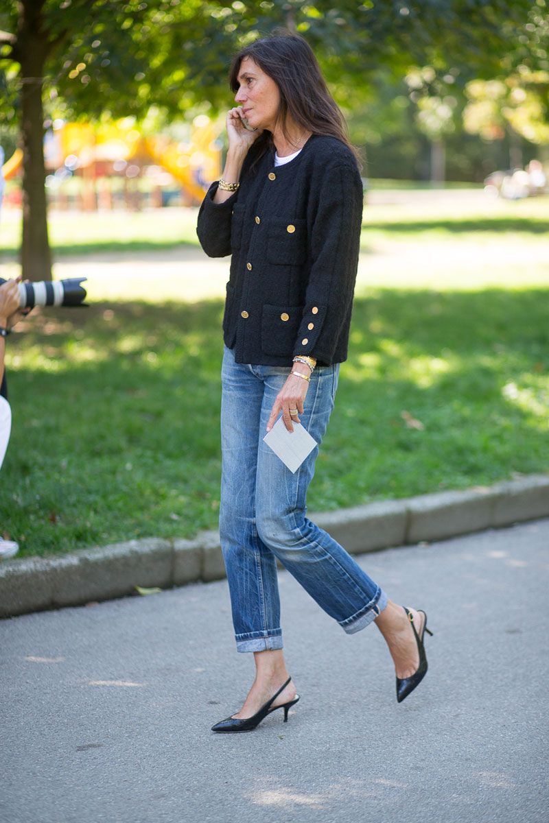 Emanuelle Alt wearing black tweed jacket with jeans and kitten heels talking on the phone