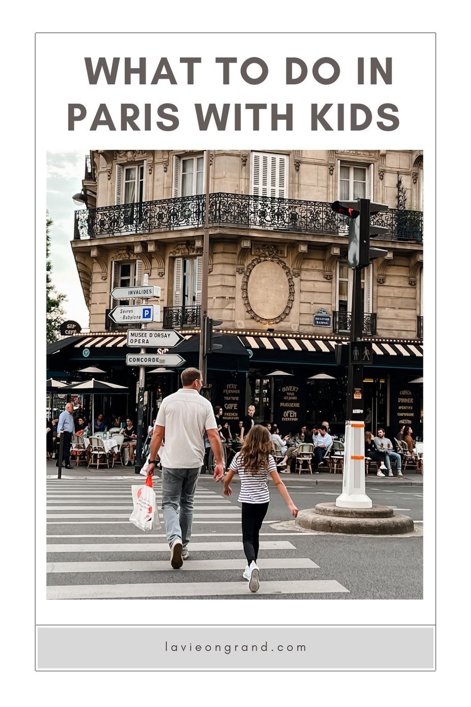 dad and daughter walking across the street in Paris 