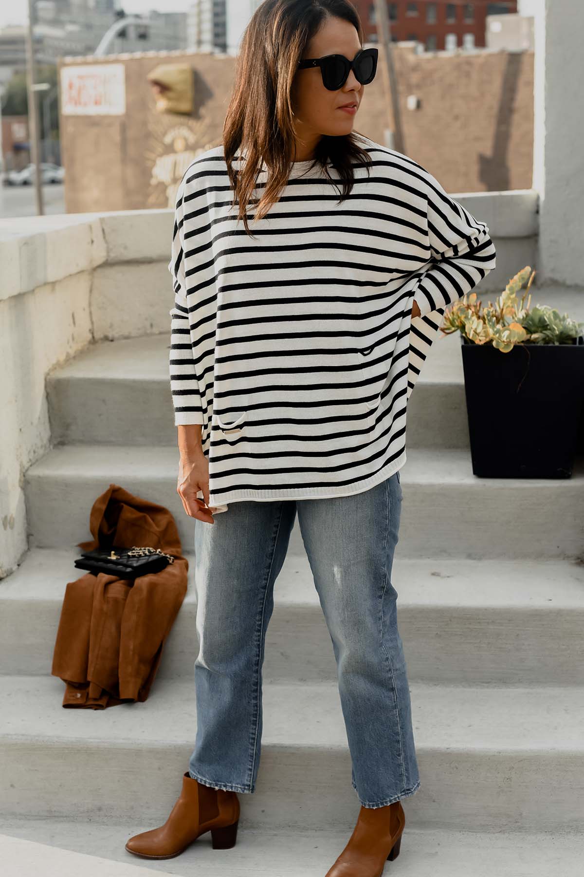 wearing striped top with jeans and boots
