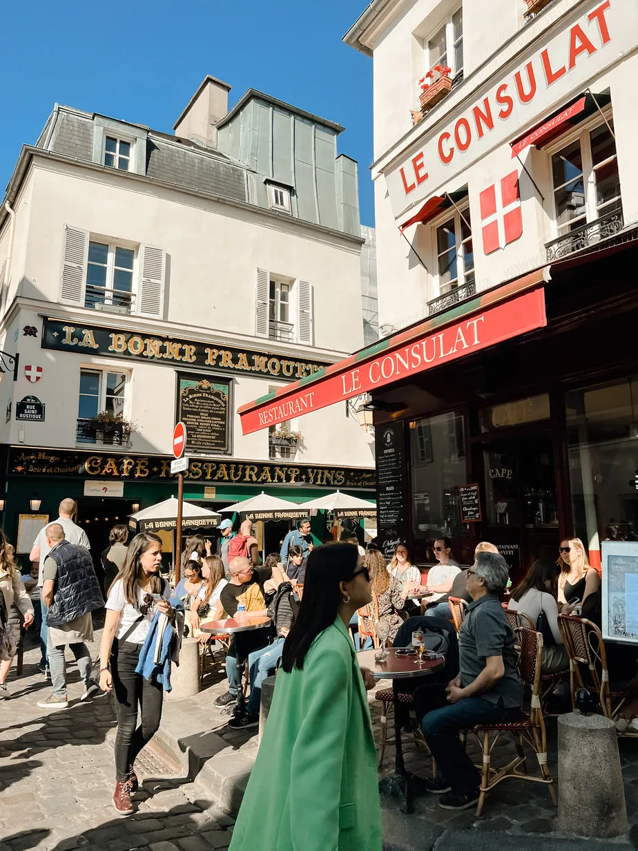 people outside cafes in montmatre for french fridays