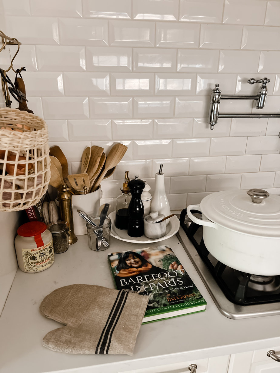 lecrueset pot sitting atop a stove