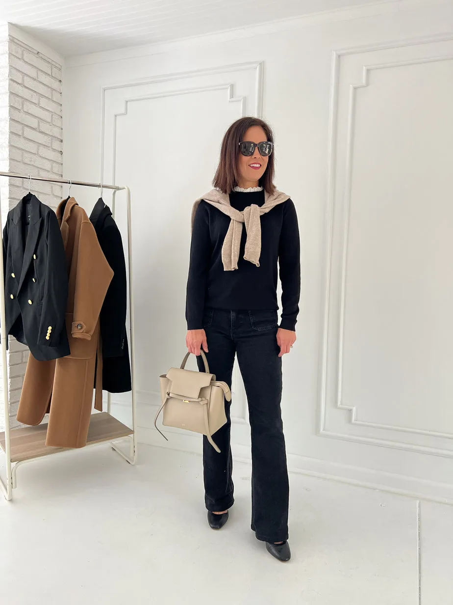 Wearing black sweater with black jeans, shoes, celine handbag
