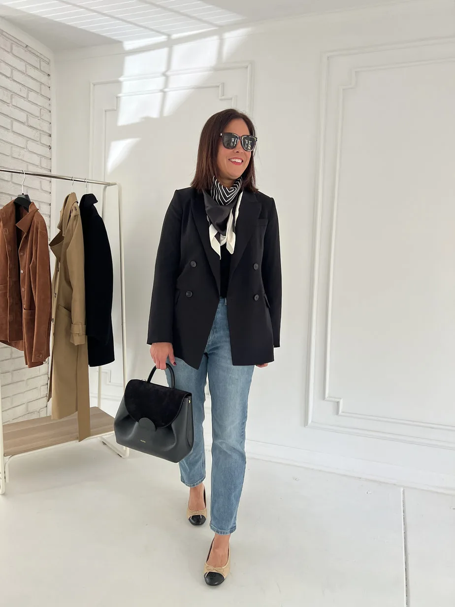Wearing black blazer with blue denim, chanel ballet flats.