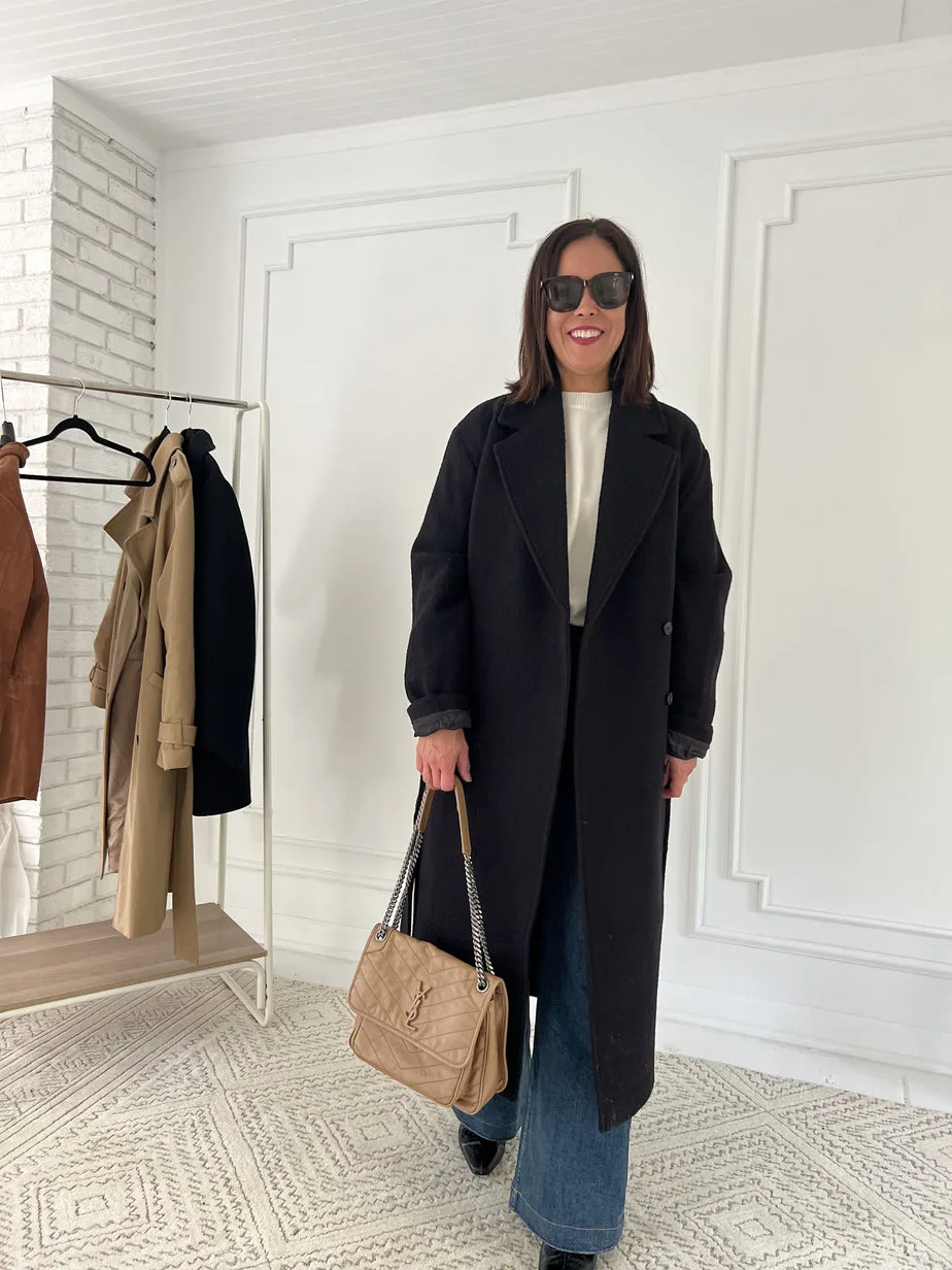 Wearing black coat with flare denim, cream sweater and ysl leather bag.