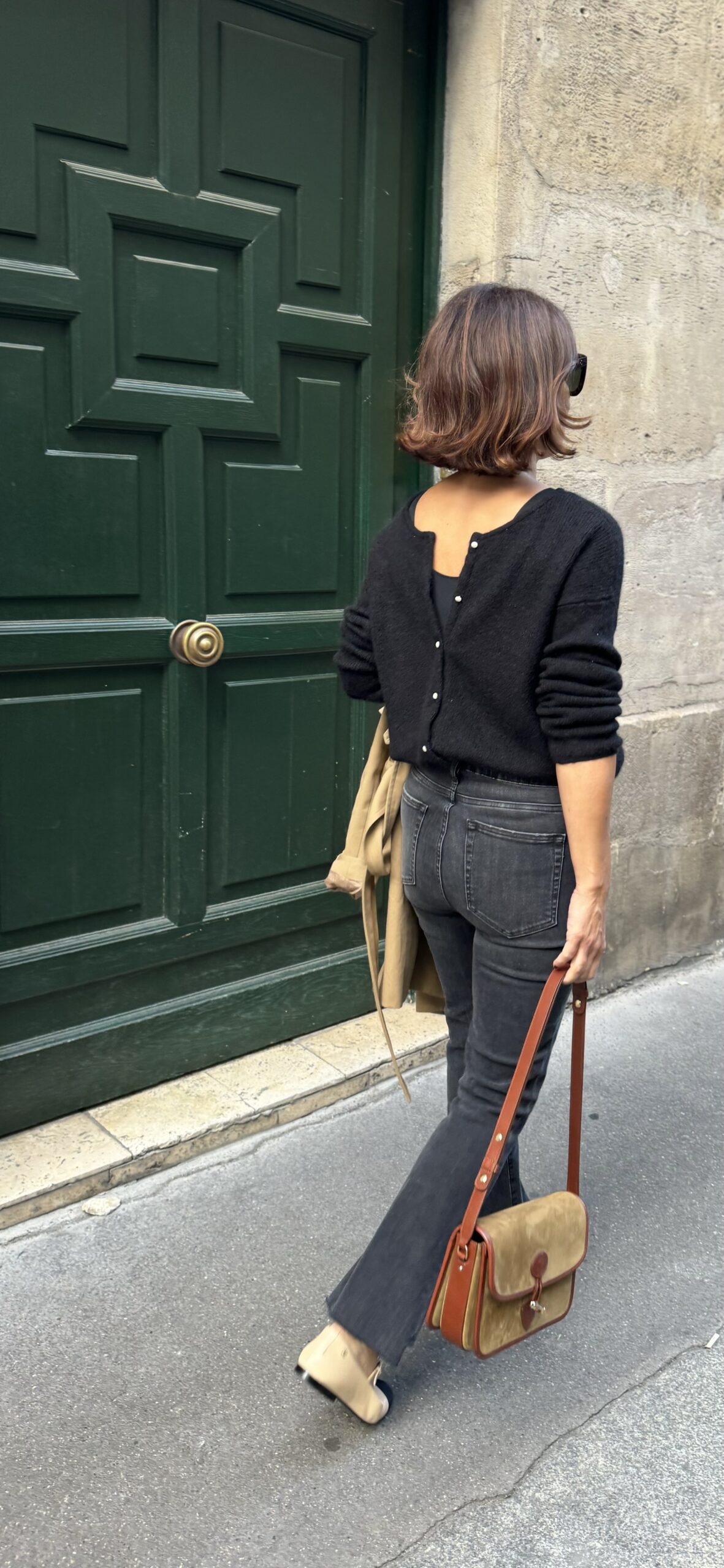 cardigan with jeans paris Woman wearing cardigan with denim and ballet flats.
