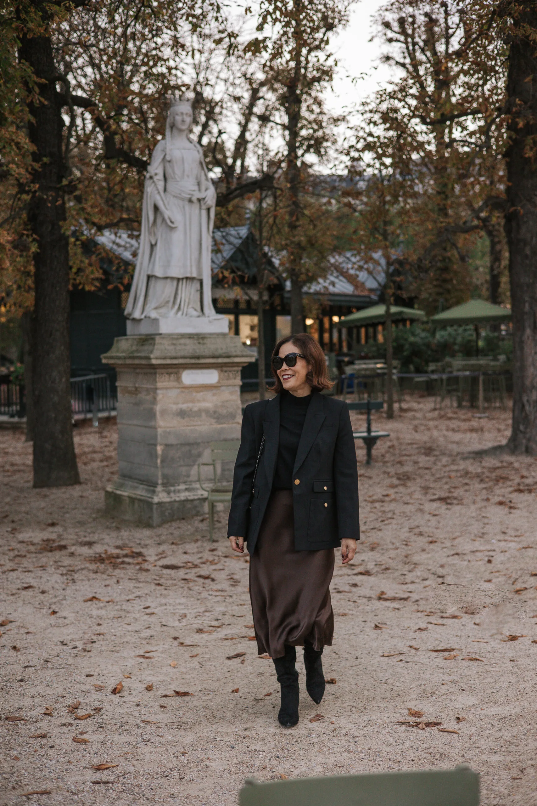 Woman walking in Luxembourg Gardens.