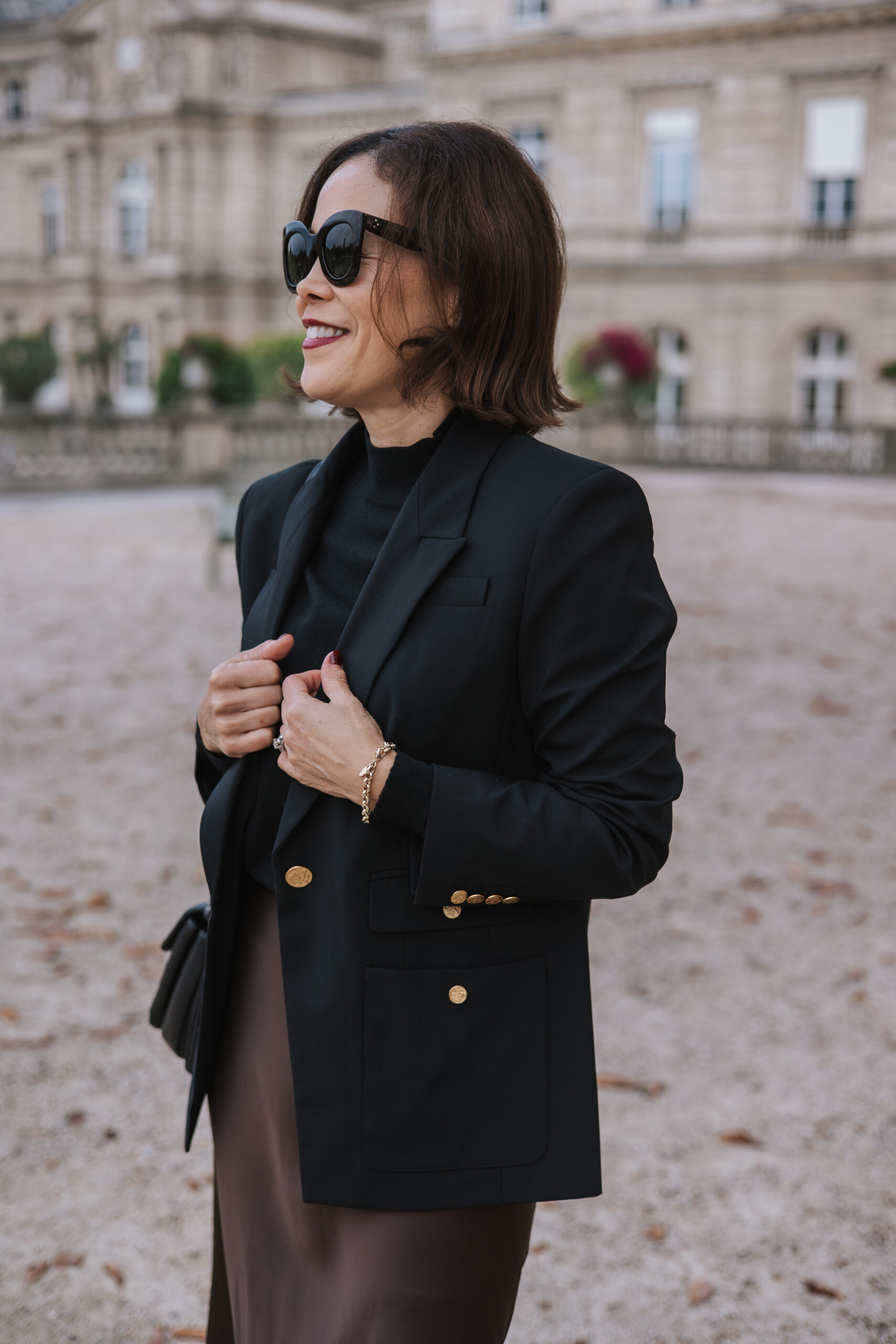 Luxembourg Gardens black blazer Woman in Luxembourg Gardens wearing black blazer.