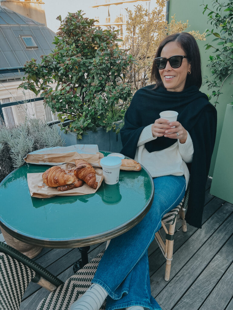 Sitting eating croissants and drinking coffee in Paris.