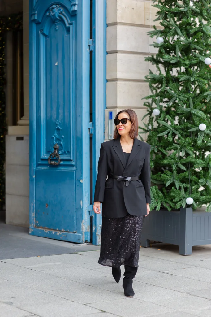 sequin skirt and black blazer Woman in sequin skirt and black blazer.