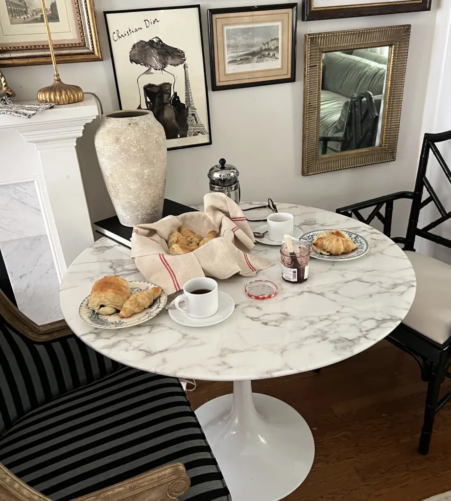 Coffee and croissants sitting on a white table.