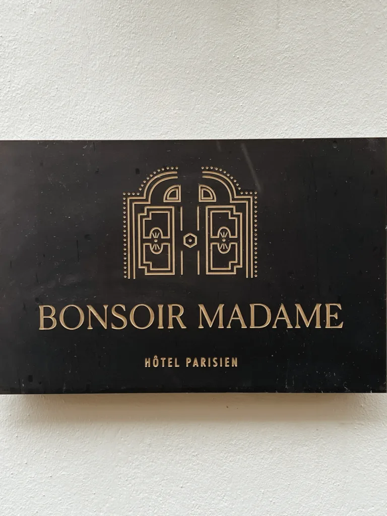Sign of Hotel Bonsoir Madame in Paris.