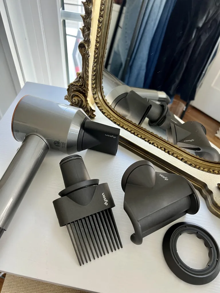Dyson hairdryer with attachements.