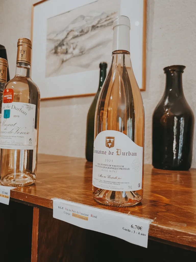 rose wine bottle Bottle of rose wine sitting on a shelf.