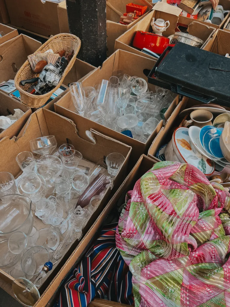 glasses in a box on the ground | The Best Flea Market In Paris
