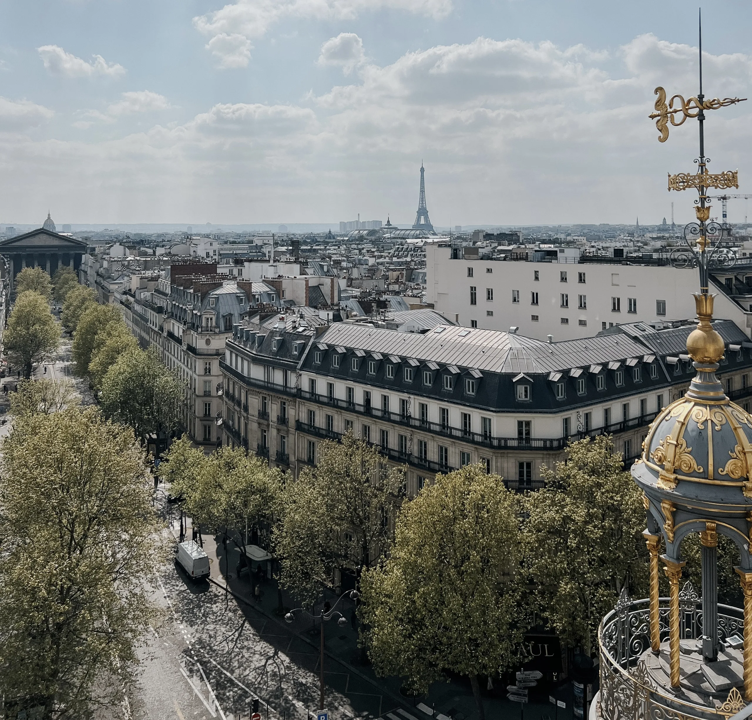 View of the eiffel tower on a sunny summer day discussing what to pack for Paris in summer and June.