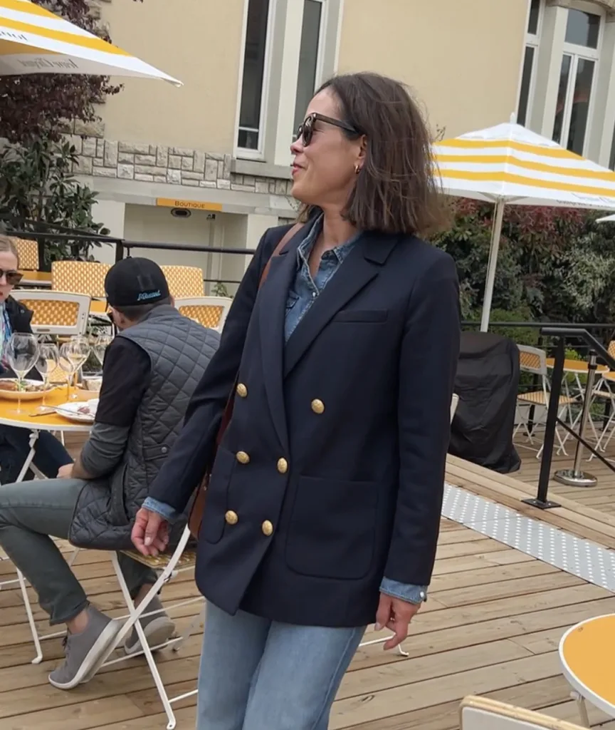 Woman wearing navy blazer with denim | A Guide To Sézane Sizing