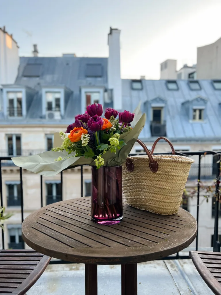 flowers and market bag sitting on table in Paris | French Fridays Week 17