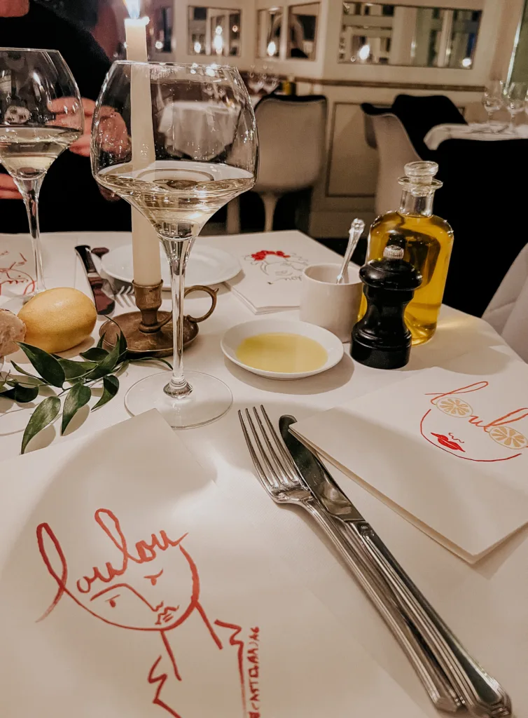 Dinner menu in Paris Dinner menu, fork and knife on a table in paris.