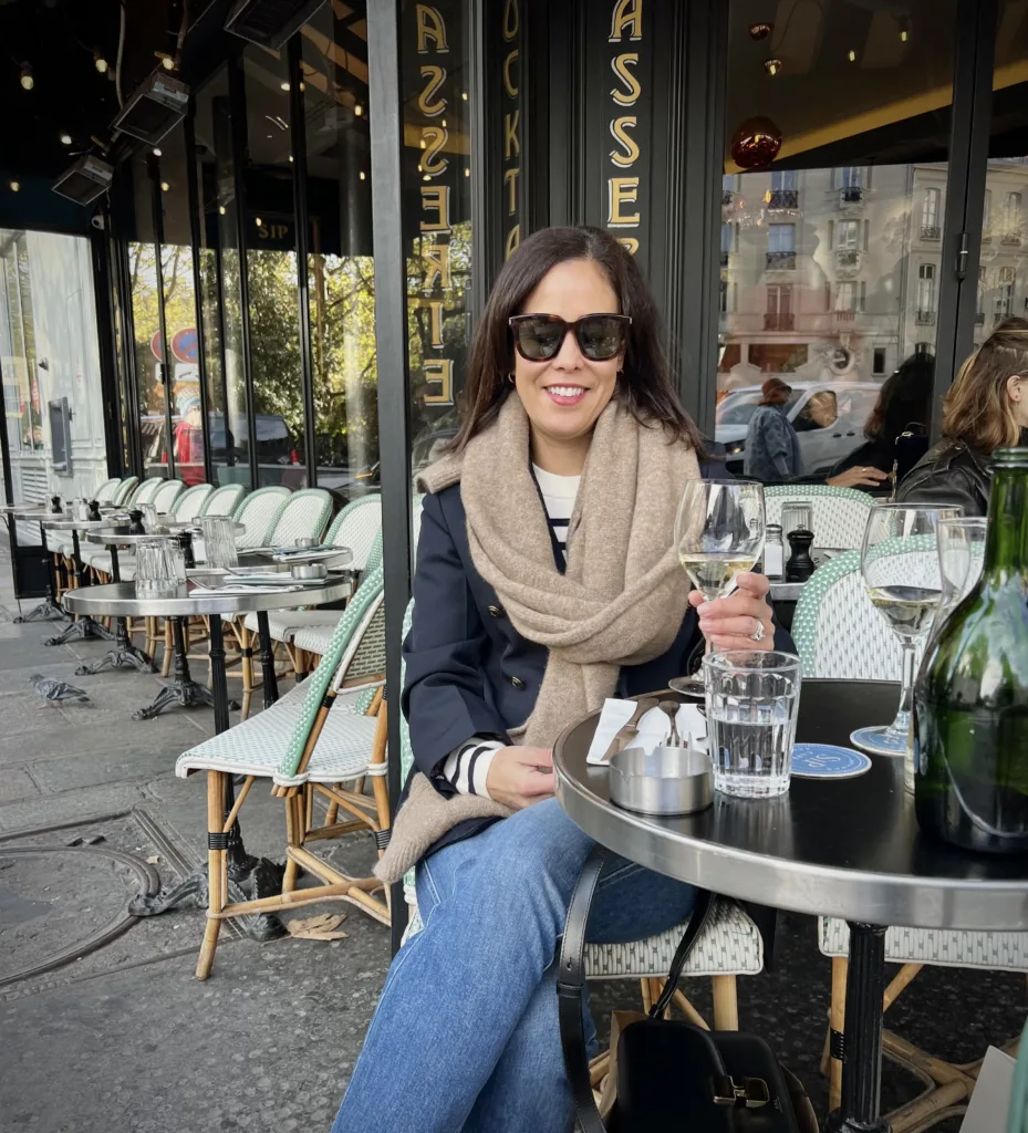 Woman at cafe with scarf, stripe sweater and sneakers | French Inspired Pieces To Buy From The Nordstrom Sale