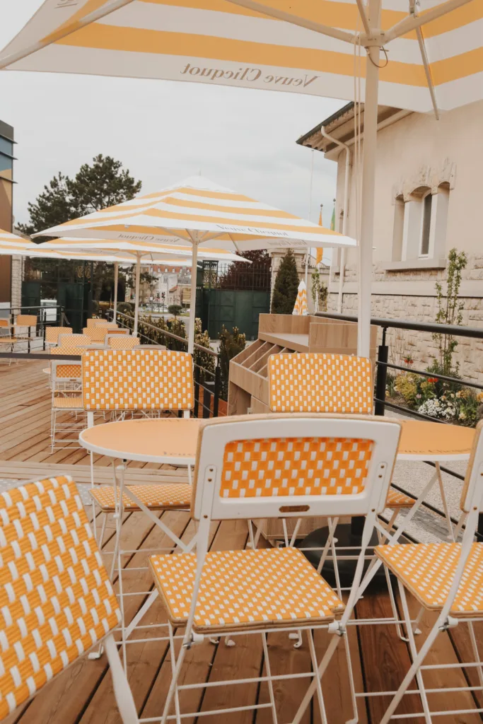 Yellow table and chairs at Veuve Clicquot.
