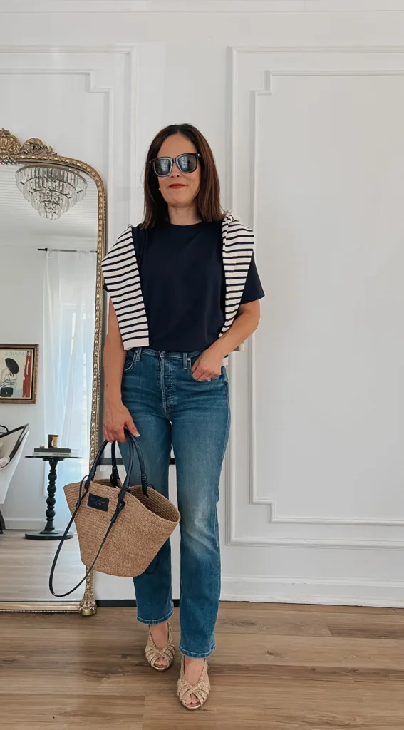 Navy t-shirt with stripe sweater and jeans.