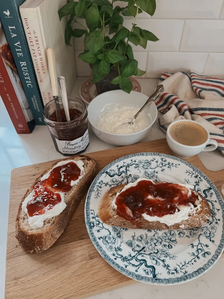 Piece of bread sitting on a blue and white plate.