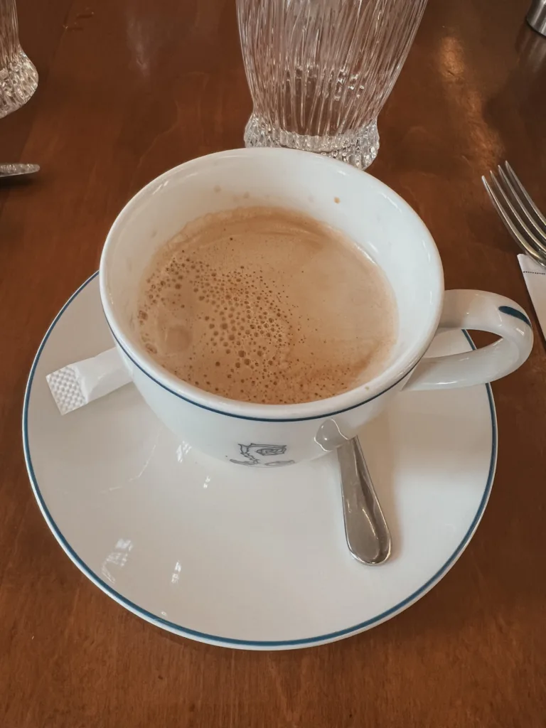 mug of coffee mug of coffee sitting on a table.