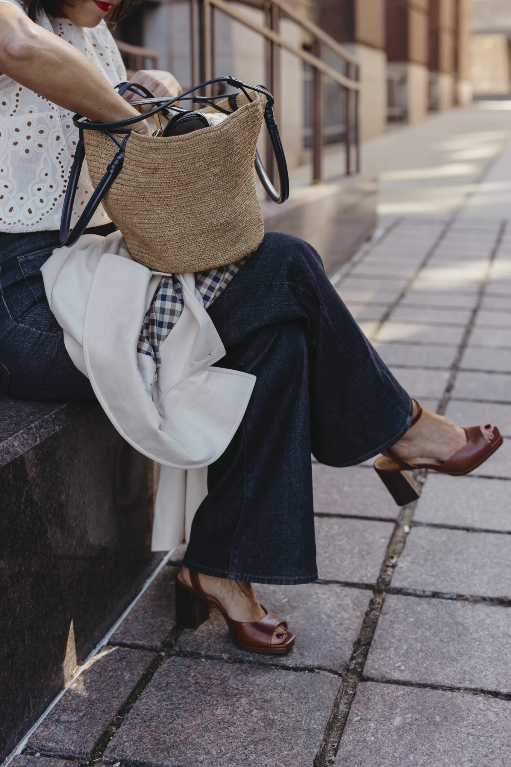 Woman opening french market bag to use for spring.