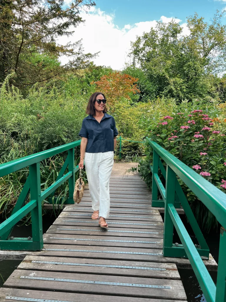 Claude Monet's green bridge Woman walking across Claude Monet's green bridge.