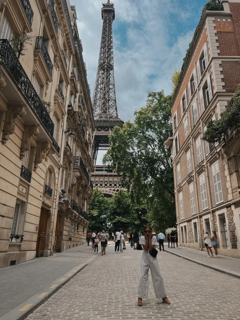 street in front of eiffel tower Little girl standing on a street in front of eiffel tower.