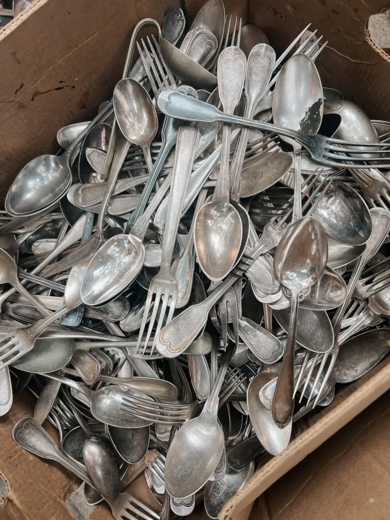 Antique silverware in a box.