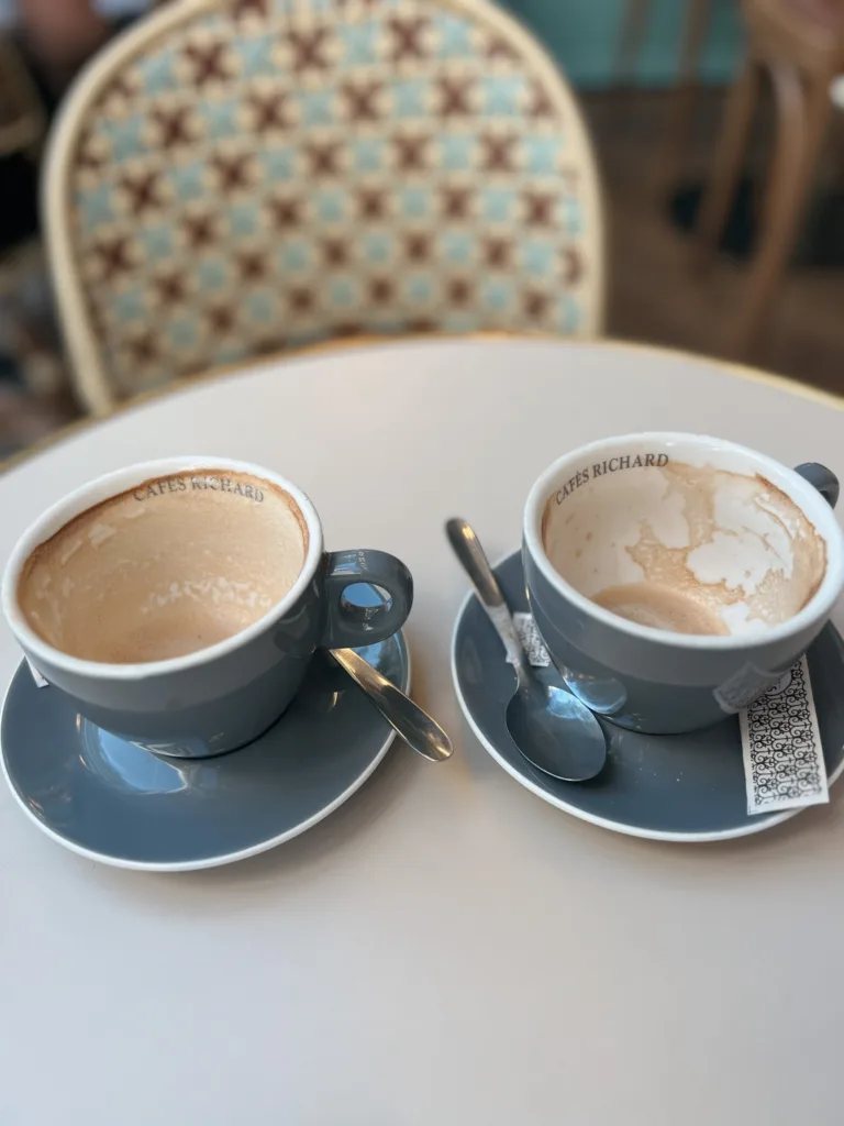 empty coffee cups Two blue coffee cups sitting on a table in Paris empty.
