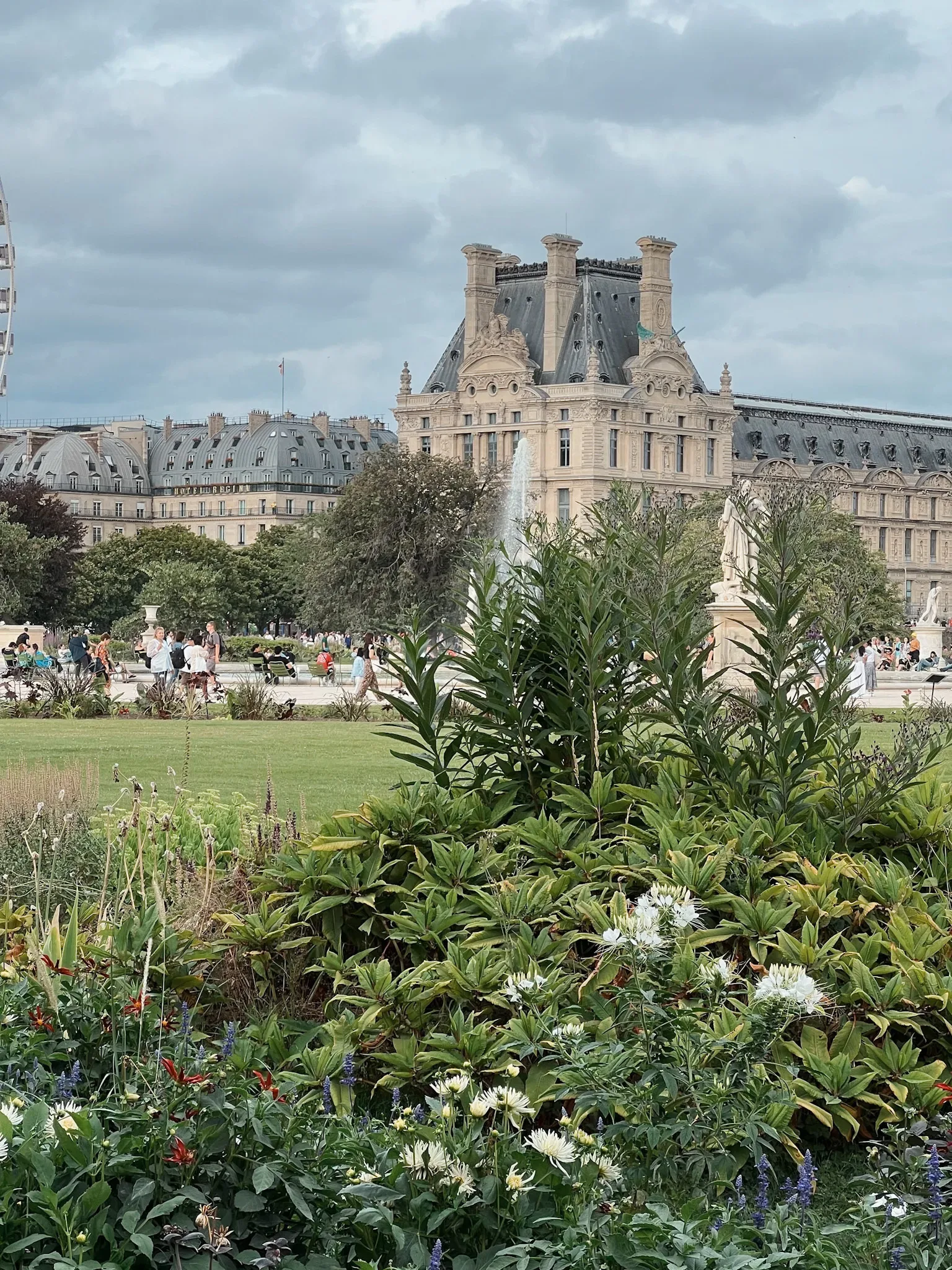 View of the Louvre in the background with flowers in front.