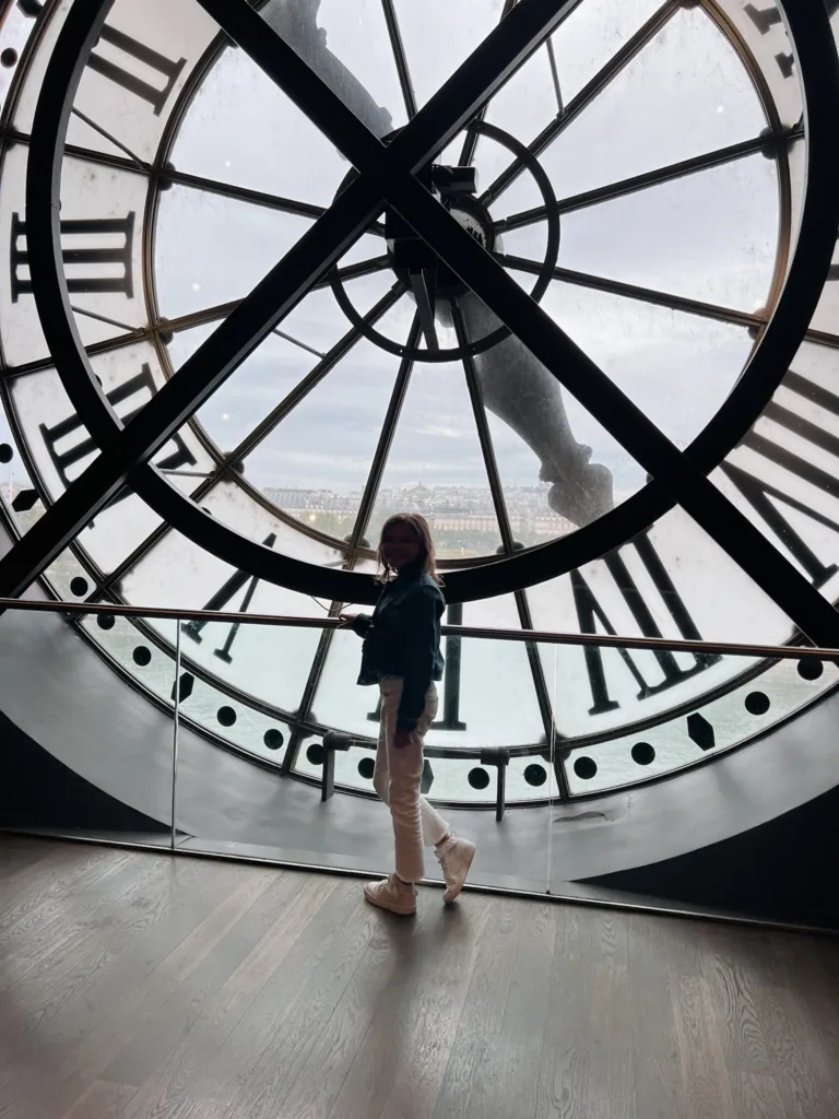 musee d'orsay clock A little girl standing in front of the clock inside the musee d'orsay.