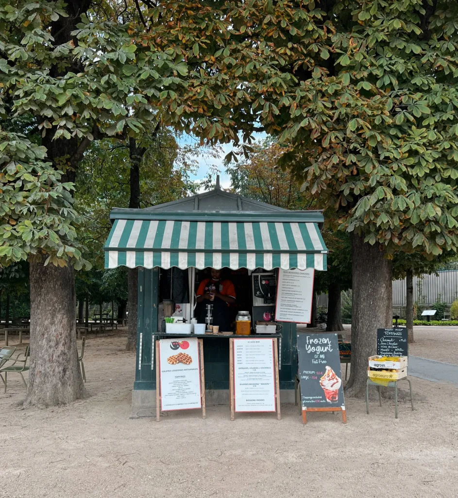 Ice cream stand Paris Ice cream stand with green and white awning in Paris.