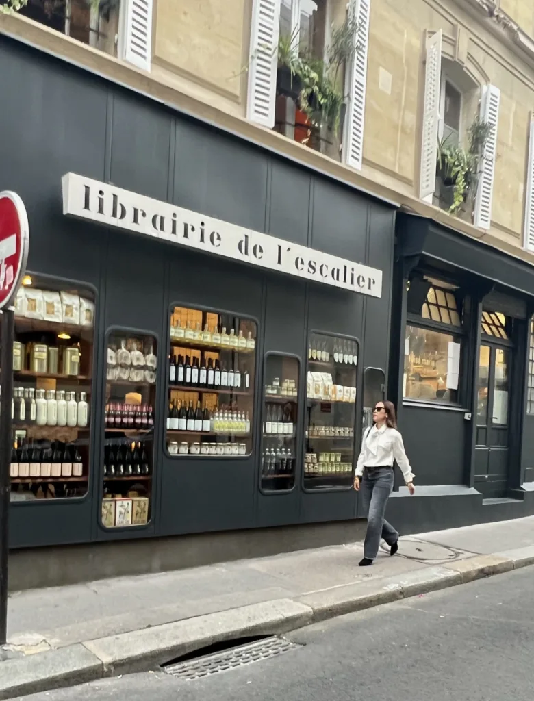 silk top and jeans Woman walking down road with silk top and jeans.