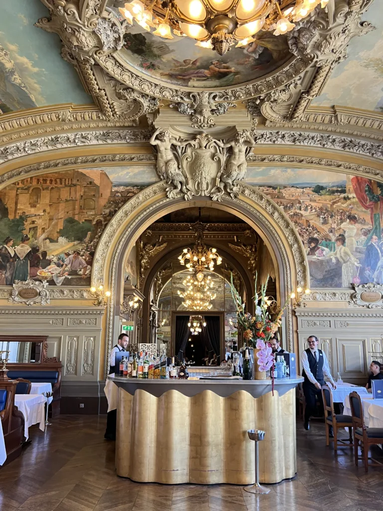 Inside of Le Train Bleu Inside of Le Train Bleu and gold painted ceilings.