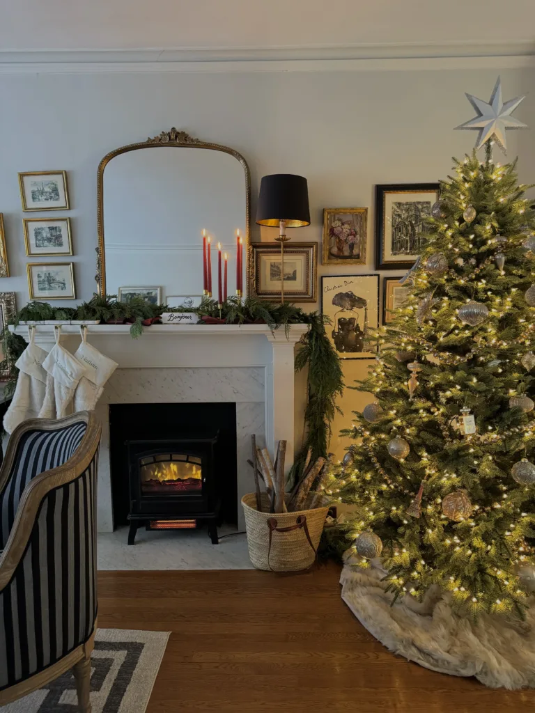 French Inspired Mantle Christmas tree with lights and mantle with fire going.