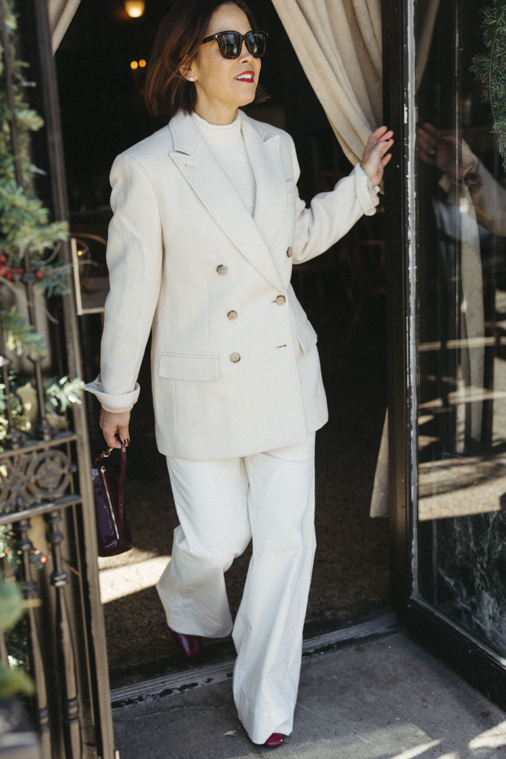Woman in all white suit for a party look.