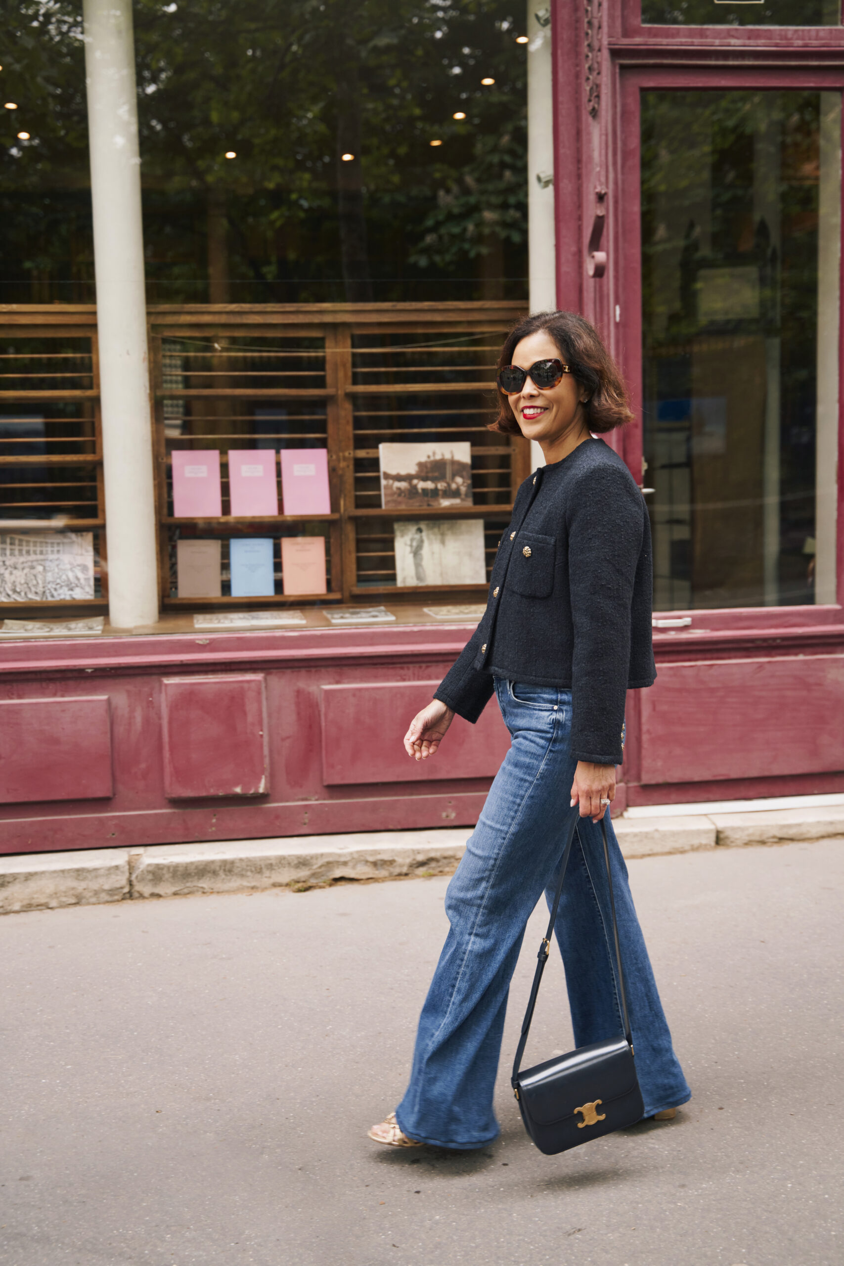 Woman wearing tweed jacket in Paris, classic french wardrobe piece.