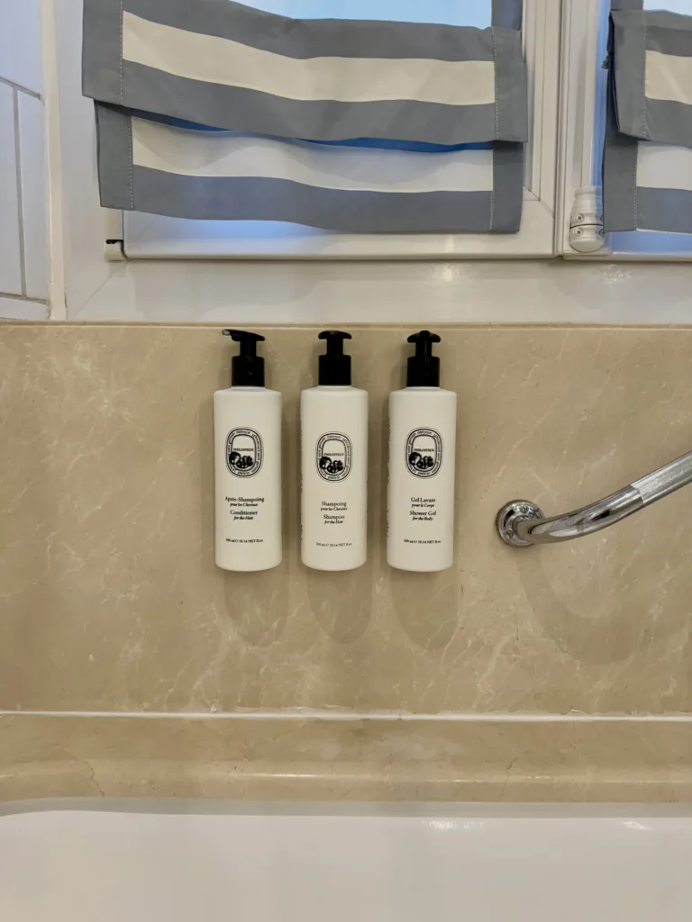 Diptyque shampoo in bathroom.