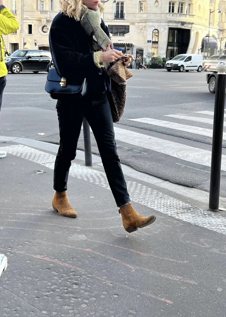 How to pack for Paris in Winter wearing boots, leather bag, looking stylish and chic.