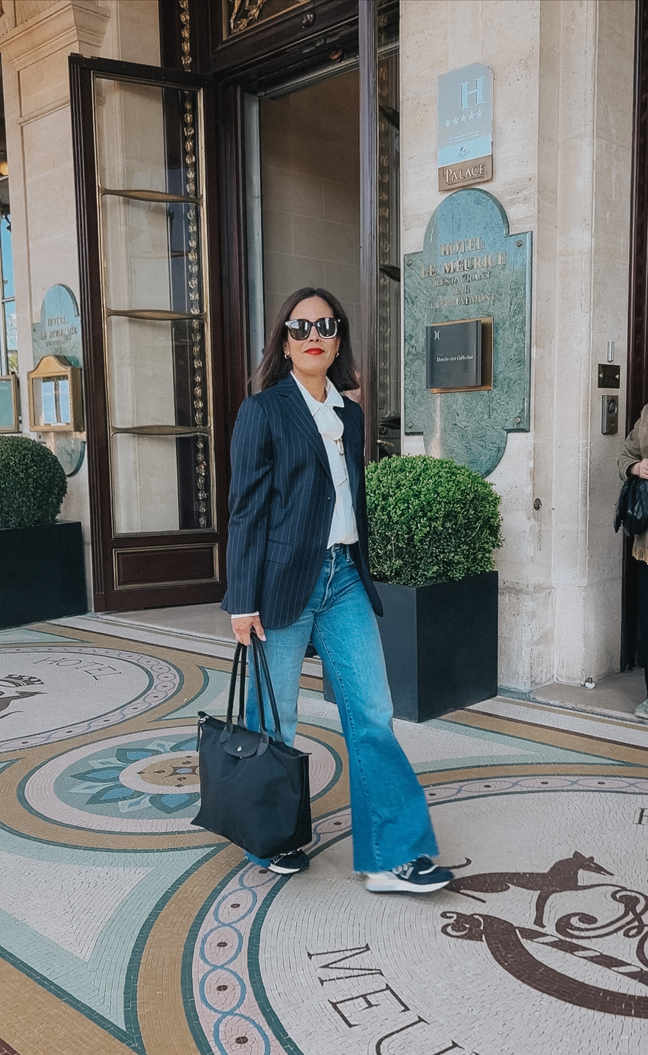 Longchamp Le Pliage tote bag used as a practical travel essential in Paris