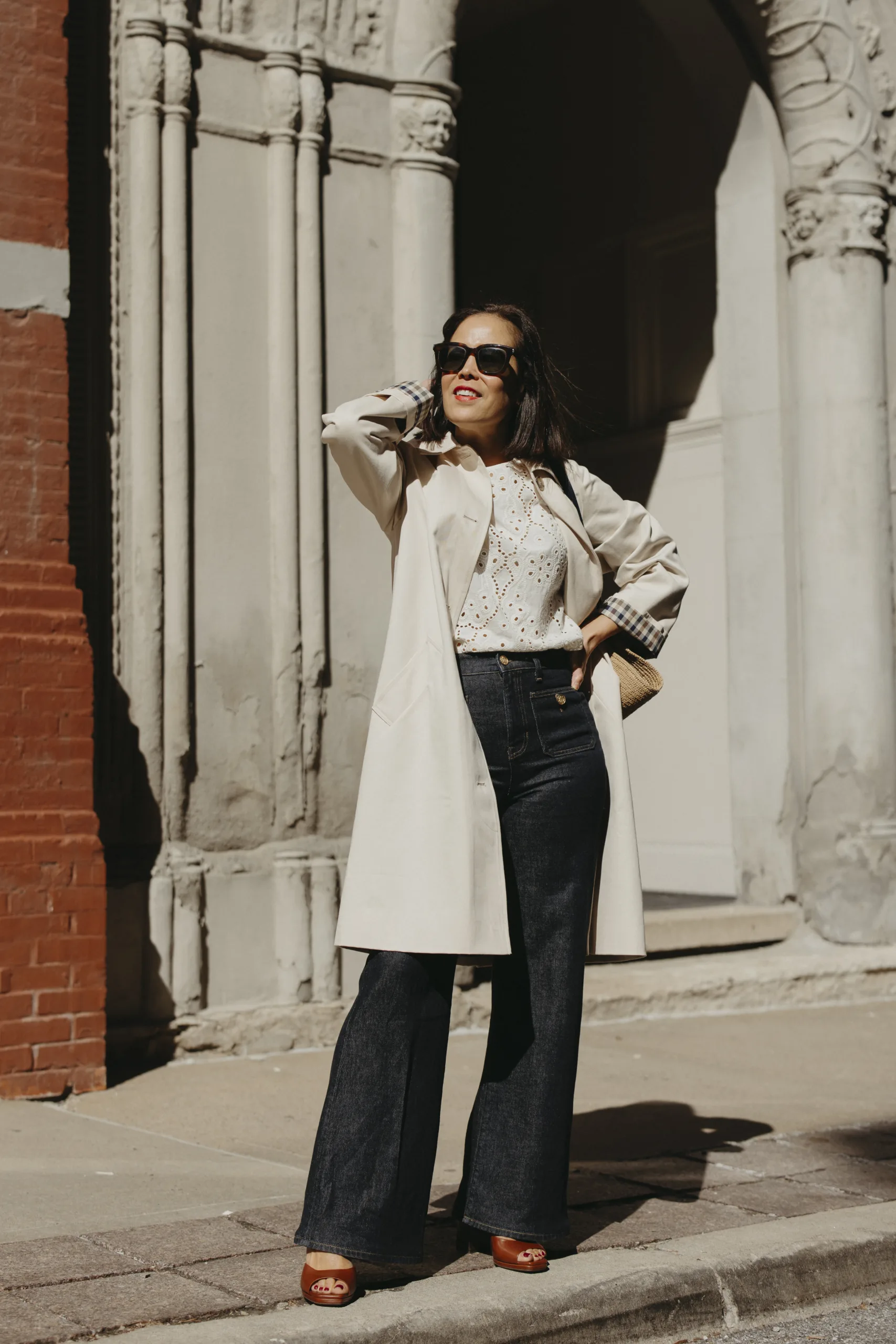 Trench coat french girl inspired with jeans and sandals.