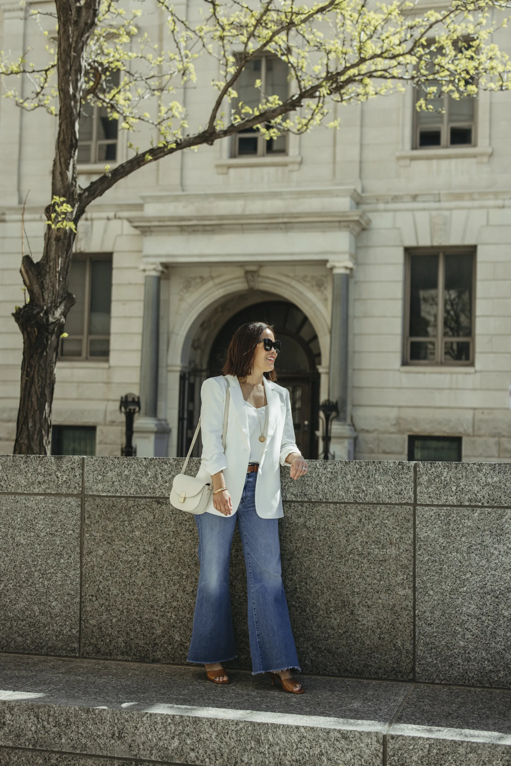 White blazer and denim jeans with silk cami are pieces I am wearing for spring.