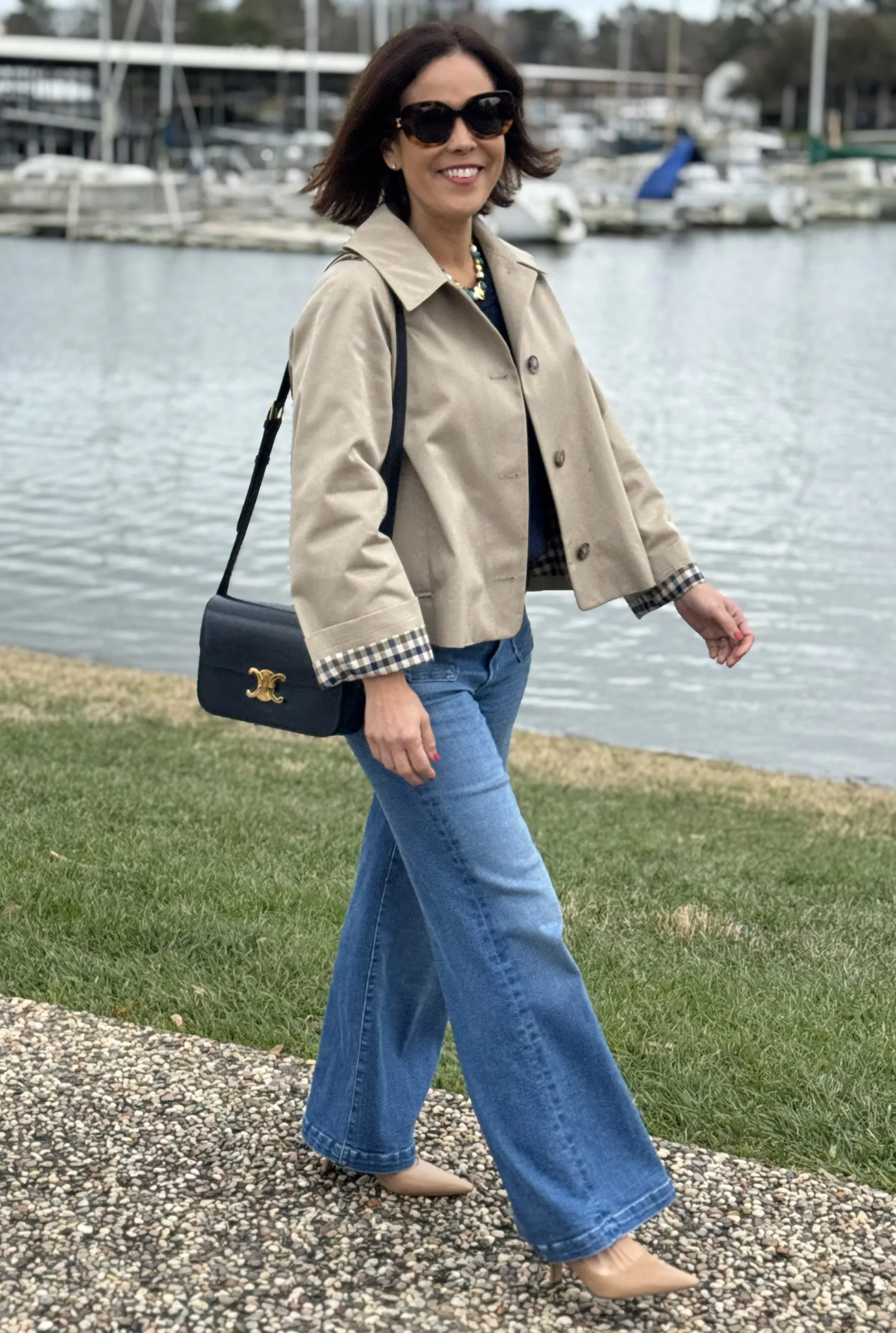 Woman wearing trench coat with slingbacks.
