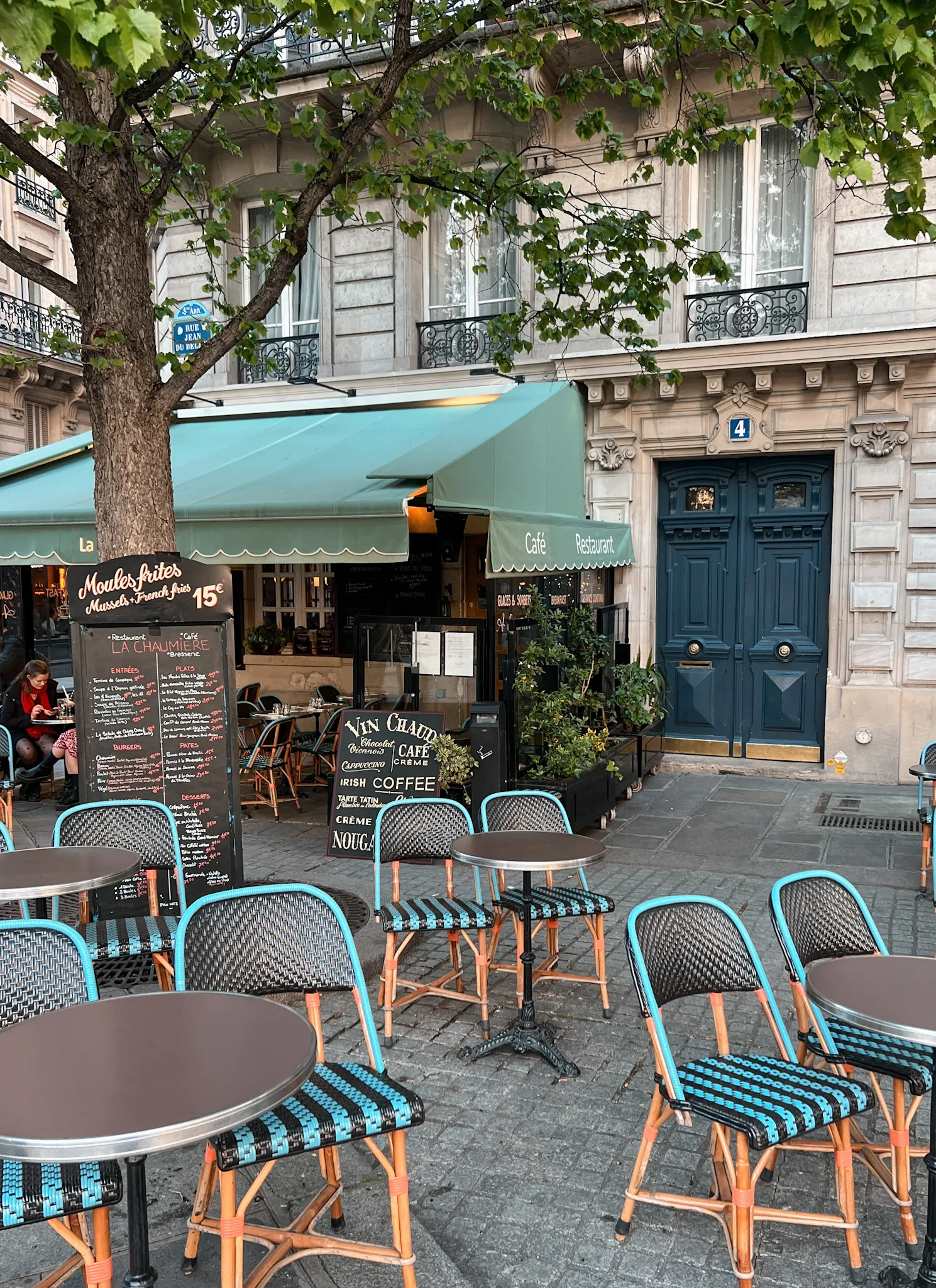 chairs outside paris discussing how to plan a solo trip to Paris.