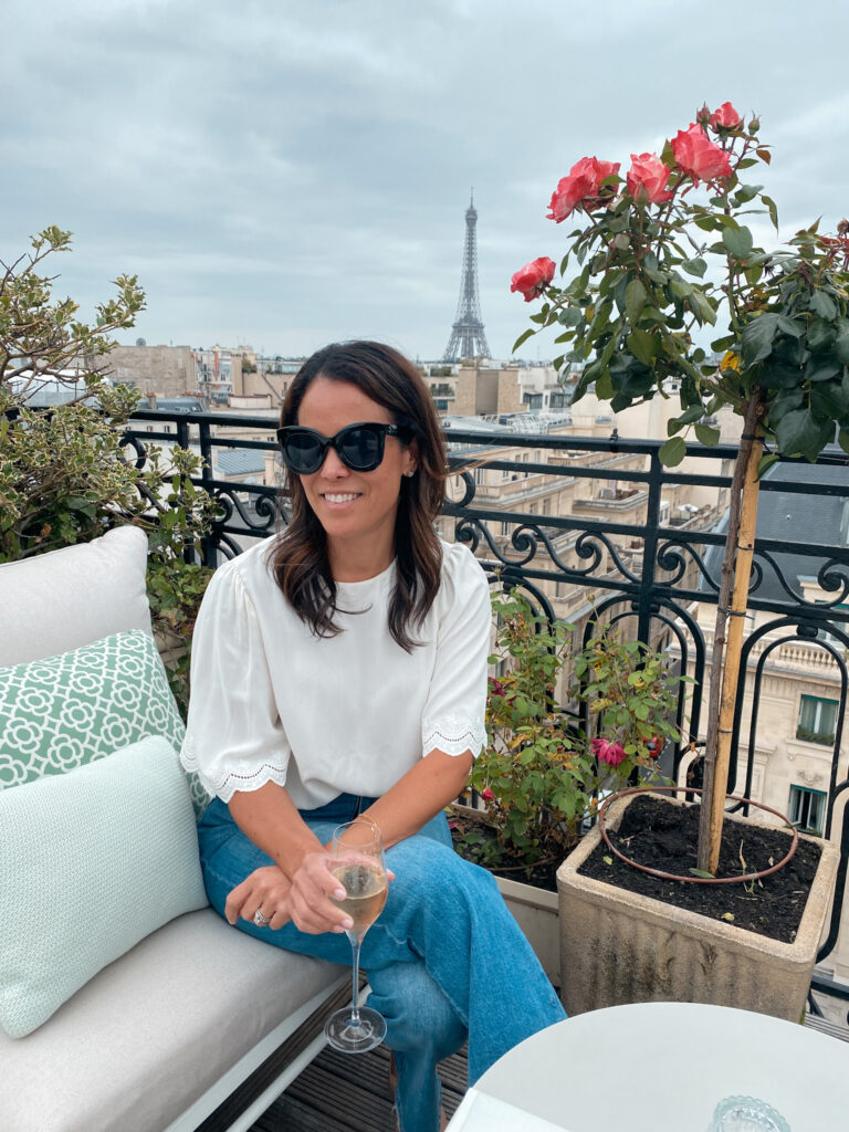 Sitting outside at a rooftop bar in Paris.