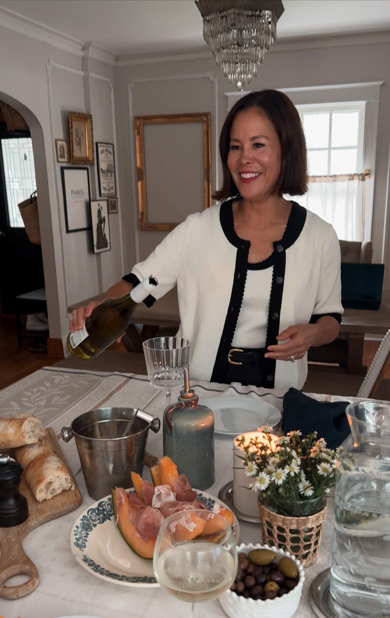 Lady pouring glass of wine.